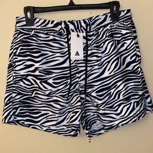 ASOS* Another Influence zebra swim shorts, side pockets and one back pocket.